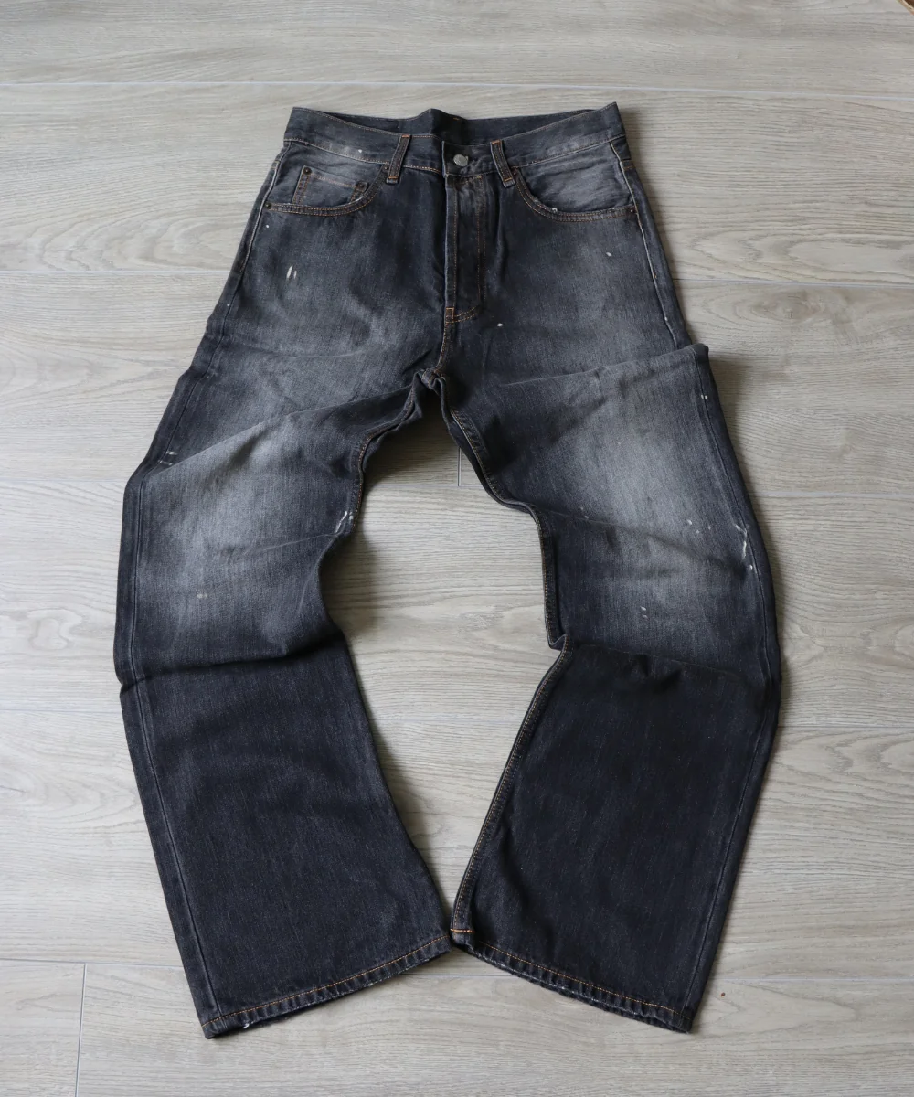 Washed denim jeans laid flat — arrival photo from a Fishgoo clothing haul