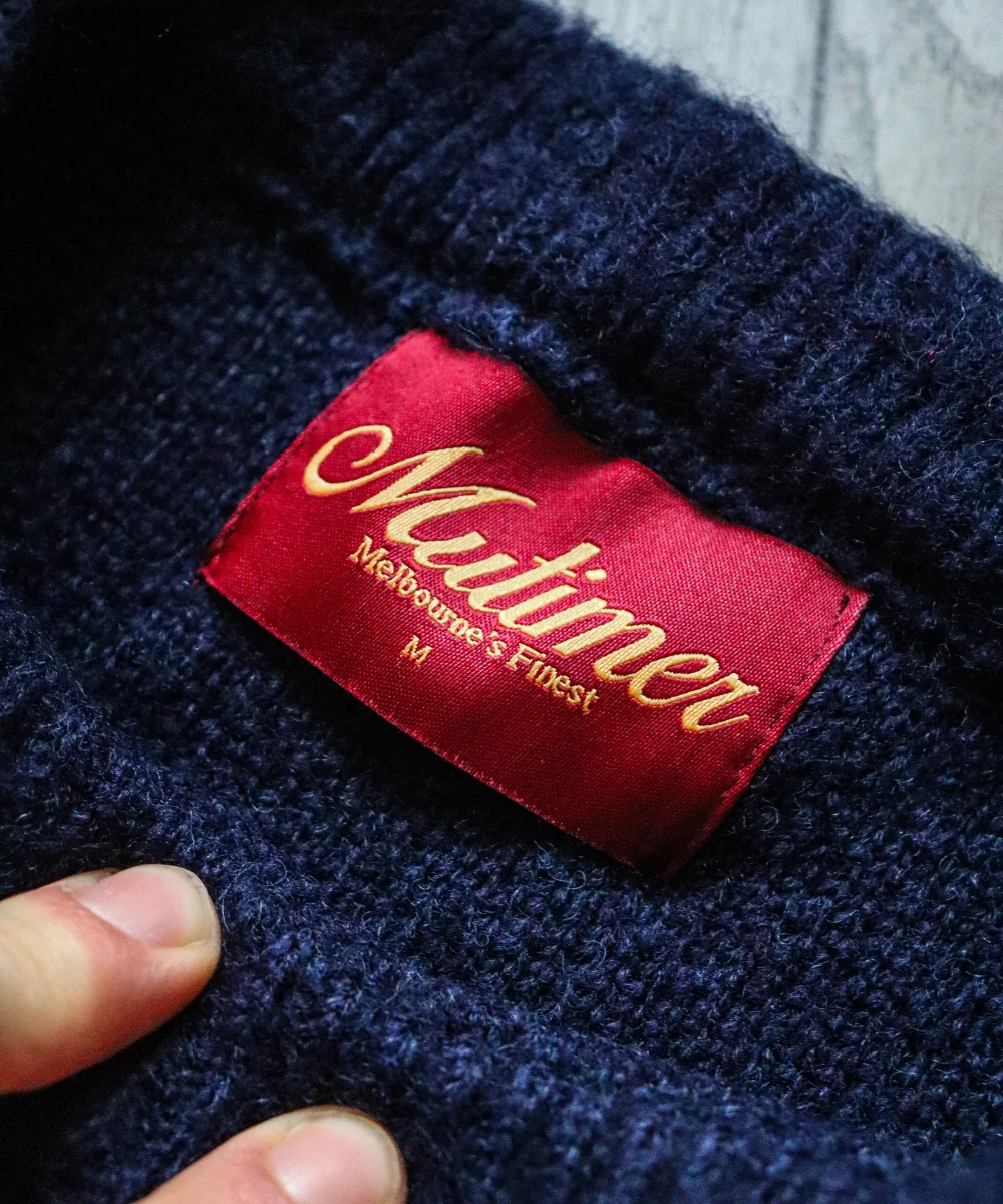Navy knitwear — label and fabric close-up