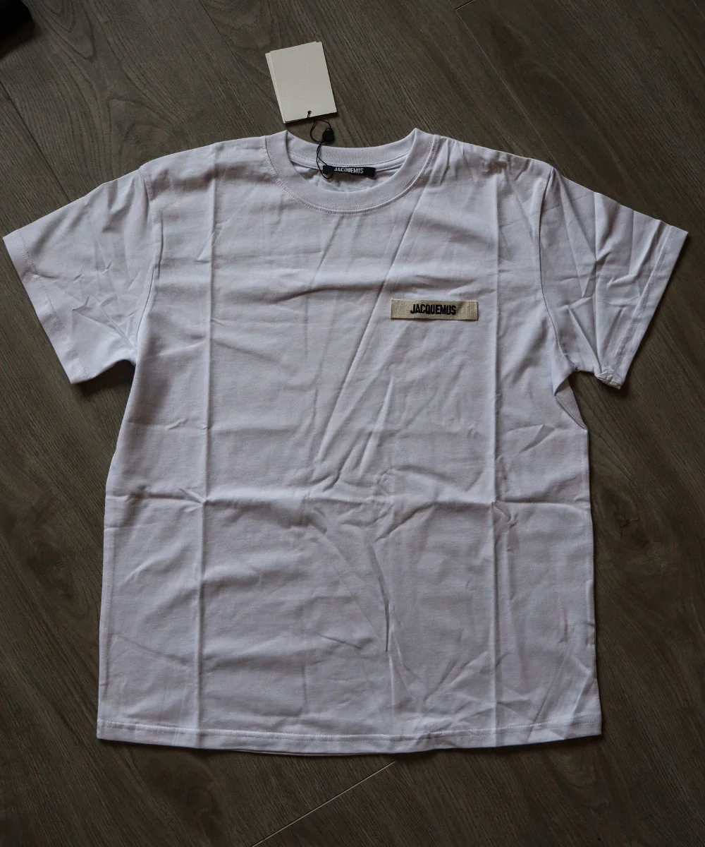 White Jacquemus-labelled short-sleeve shirt laid flat