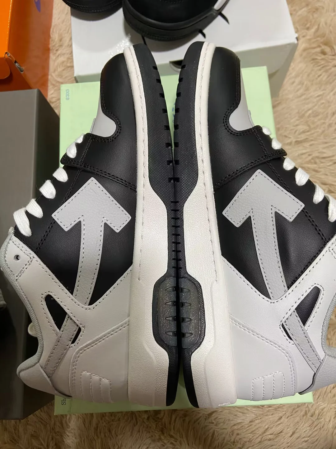 Black and white Off-White-style sneakers — side view