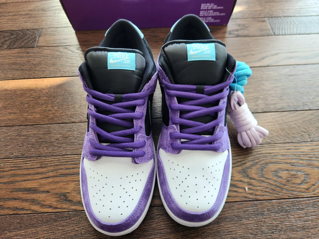 Purple SB sneakers — front view