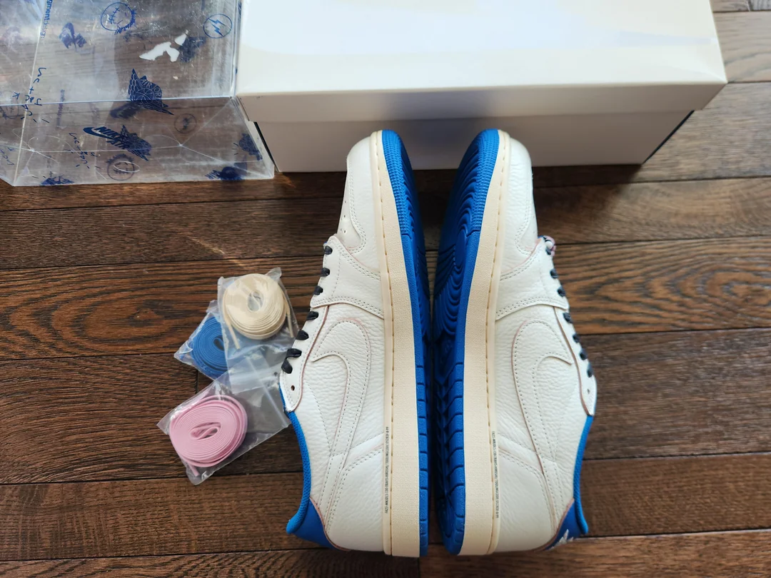 White and blue Fragment-style Jordan low-tops — side view