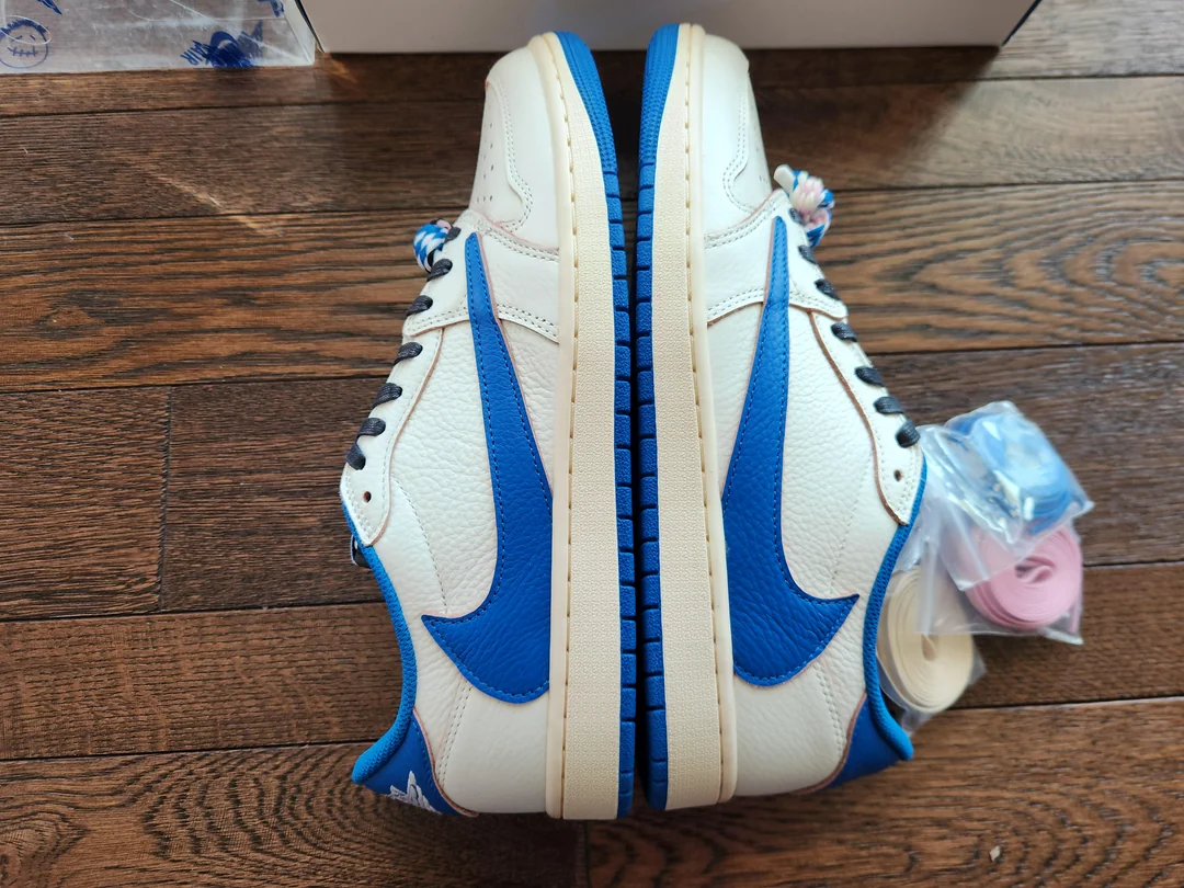 White and blue Jordan low-tops — paired side view