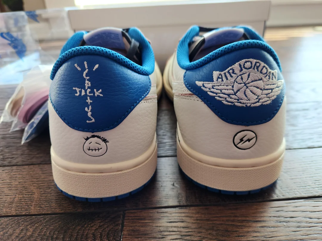 White and blue Jordan low-tops — heels