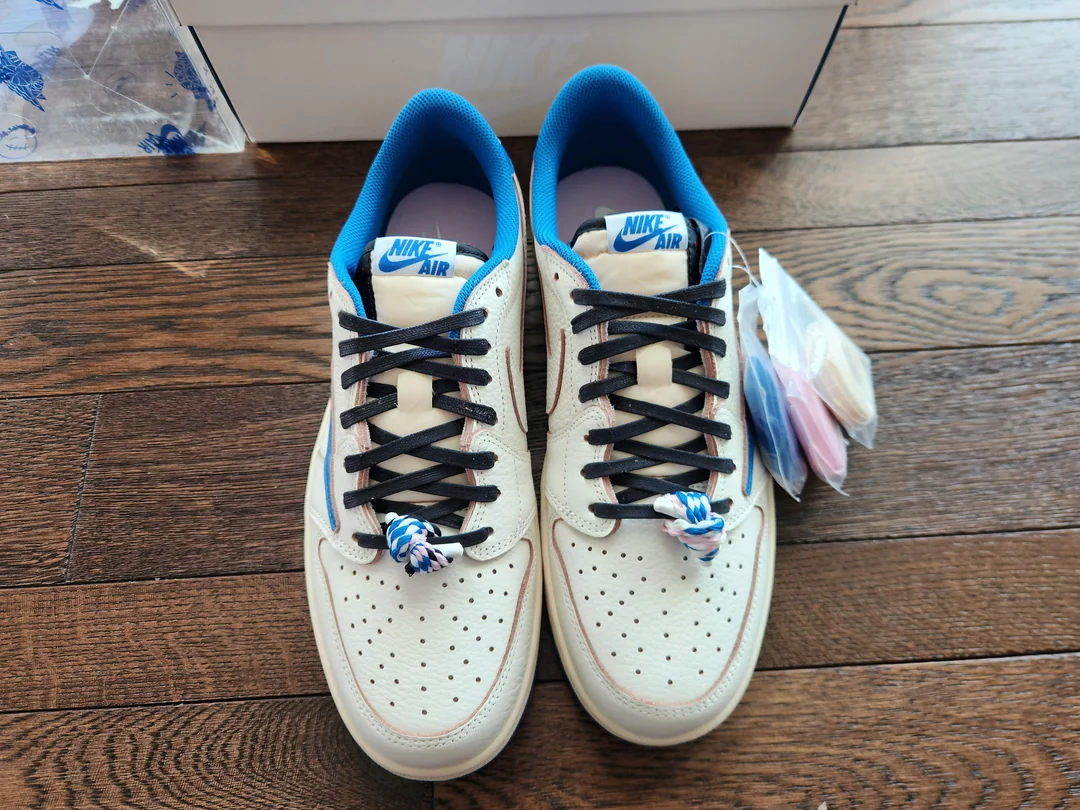 White and blue Jordan low-tops — front view