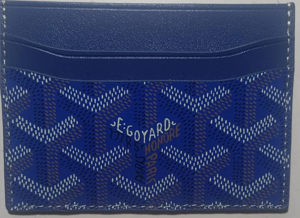 Blue cardholder after arrival — patterned reverse